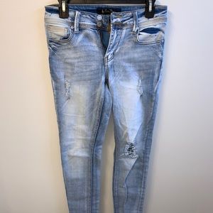 Distressed light wash jeans
